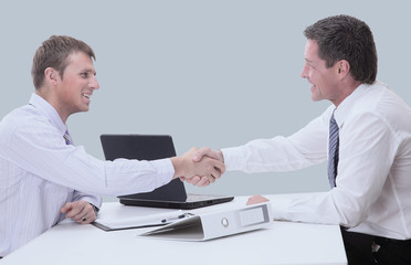 Fototapeta premium Business people shaking hands to seal a deal