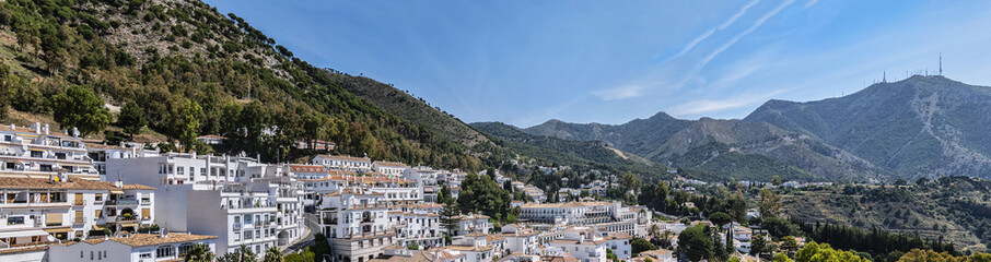 Beautiful aerial view of Mijas - Spanish hill town overlooking the Costa del Sol, not far from Malaga. Mijas known for its white-washed buildings. Mijas, Andalusia, Spain. - obrazy, fototapety, plakaty