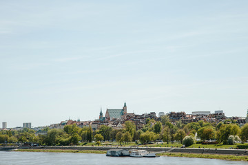 City over the river. Warsaw over the Vistula. The old town is the Polish and Viennese Boulevards. Old and owen parts of the city. Architecture. Temples and churches. High-rise buildings and historic