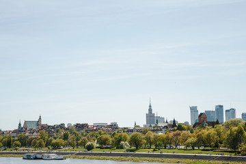 City over the river. Warsaw over the Vistula. The old town is the Polish and Viennese Boulevards. Old and owen parts of the city. Architecture. Temples and churches. High-rise buildings and historic