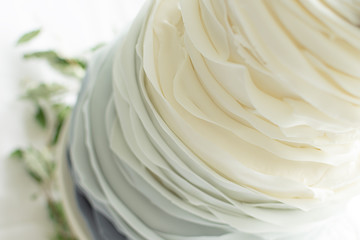 Close Up Of Ruffle Wedding Cake with Grey Ombre Gradient   © Brian