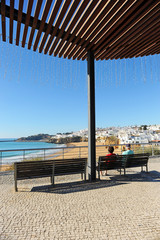 Elderly tourists in the beach of Albufeira, one of the most visited by European tourists. Algarve, south of Portugal.