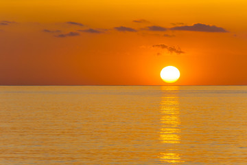 Mallorca, Orange sunrise reflecting on ocean water