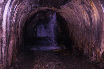 Underground waterfall. Waterfall in the sewer. The groundwater.
