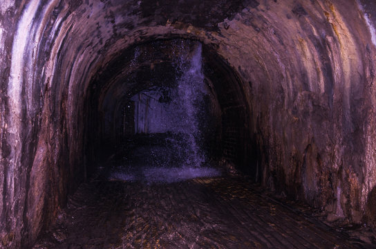 Underground waterfall. Waterfall in the sewer. The groundwater.
