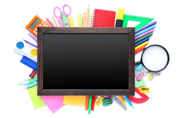School supplies with wooden frame on white background