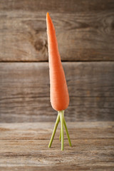 Fresh and ripe carrot on wooden table