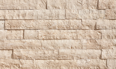 Beige Sandstone Wall Background. Surface Texture. Building design.