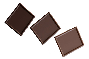 Pieces of bitter, dark and milk Chocolate isolated on a white background. World, National Day. Dessert. Sweet. Cocoa products.