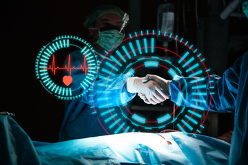 Team surgeon shaking hands with a successful operation in an operating room concept for insurance advertising.hospital brochures.