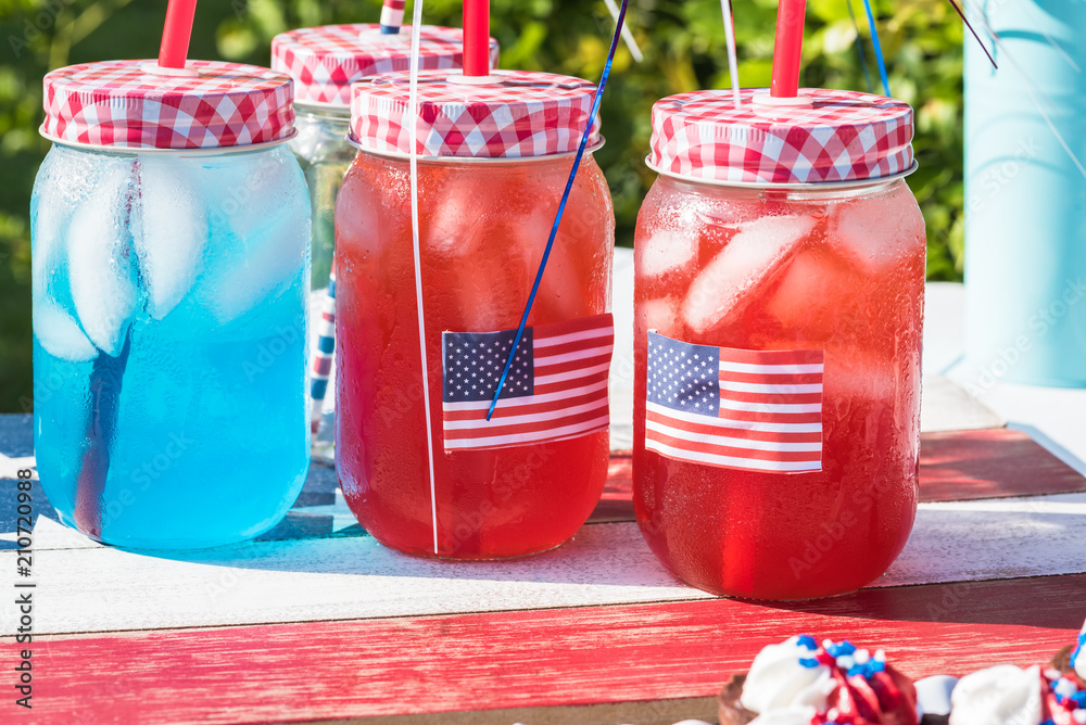 Wall mural outdoor party table with drinks for american independence day celebration.