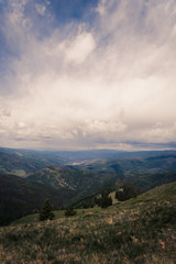 Fototapeta premium Landscape view looking over Minturn, Colorado during a storm on Vail Mountain. 