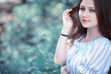 Fototapeta premium A girl in a spring green park