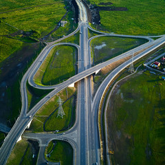 Aerial view of highway junction and overpass in city on a sunset hours.