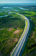 Aerial view of highway junction and overpass in city on a sunset hours.