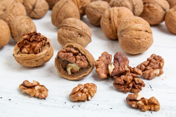 walnut on light wooden background