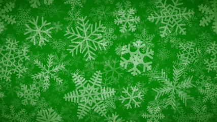 Christmas background of many layers of snowflakes of different shapes, sizes and transparency. White on green.
