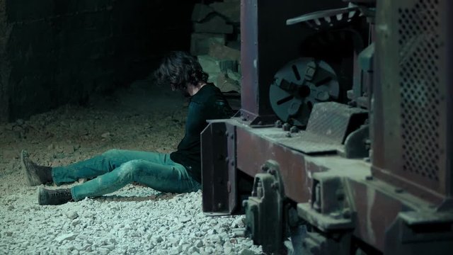 man held hostage by a psycho maniac frees himself and begins to struggle
