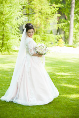 Beautiful bride with wedding bouquet 