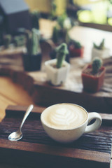 Cup of coffee latte in coffee shop