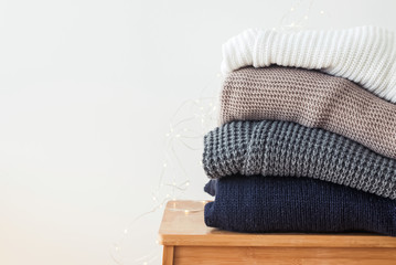 Stack of cozy winter sweaters