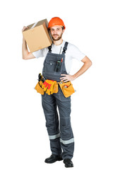 A man is a builder with a cardboard box in his hands. Isolated over white background.