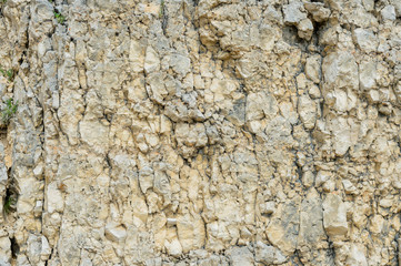Textured stone background Rubble ballast in natural form in the rock wall