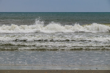 Waves breaking on the beach