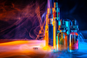 VAPE Electronic Cigarette. Liquid for VAPE. Steam from an electronic cigarette. VAPE concept