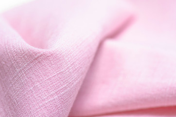 Fabric clothing flax pink macro on blur background
