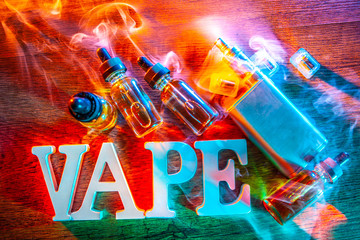 the inscription VAPE Electronic Cigarette. Liquid for VAPE. Steam from an electronic cigarette....