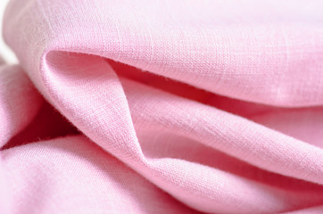 Fabric clothing flax pink macro on blur background