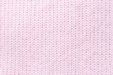 Pink texture of knitted wool fabric, background concept