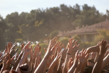 Crowded people hands up