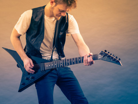 Man playing on electric guitar