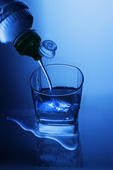 pouring water from a water bottle