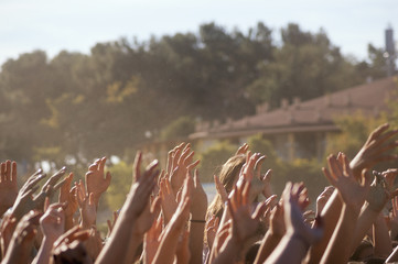 Crowded people hands up