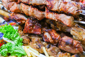 Barbecue kebab pork meat on skewers. Street food fair