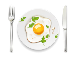 Fried eggs. Scrambled egg. Plate, fork and knife. Breakfast