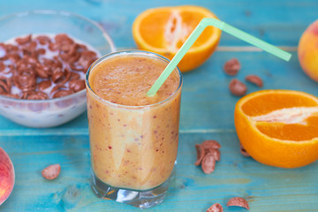 Breakfast from cereals with milk, smoothies and fresh fruit.