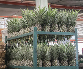 Pineapple background in the  local market in Thailand for sale.fresh pineapple from farm to the customer.
