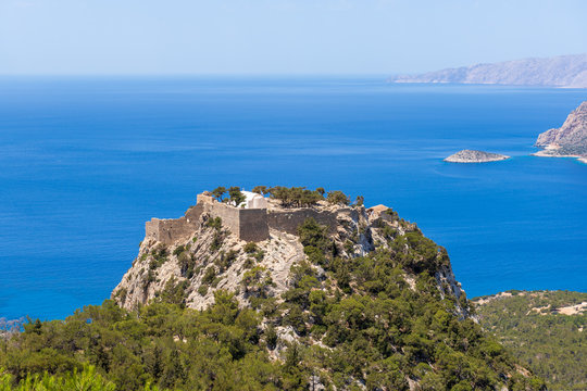The castle of Monolithos located at the summit of the tall and craggy rock. Rhodes island, Greece