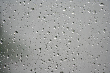 water drops on the glass on a gray background
