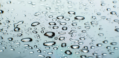 Raindrops on the glass. Wet rainy day.