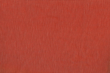 Red fabric texture background. Empty abstract cloth backdrop