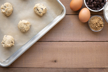 Flat lay of chocolate chip cookie baking scene with space for text