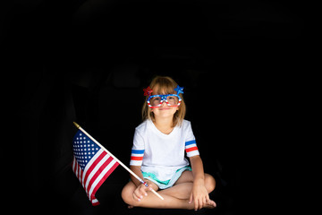 Girl wearing patriotic novelty glasses
