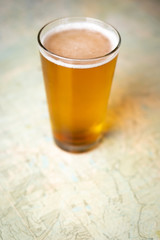 Pint of craft beer on a topographical map