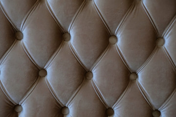a photo of close up brown upholstery sofa