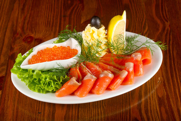 Sliced trout and red caviar